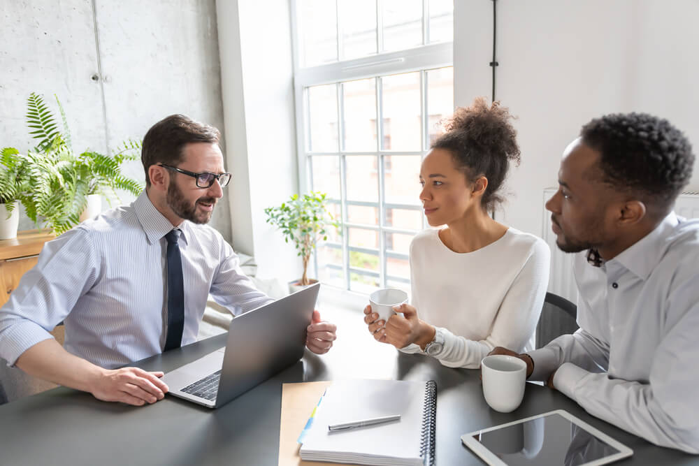 african american couple with life insurance agent