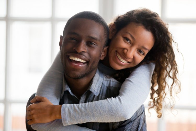 happy african american couple looking at camera