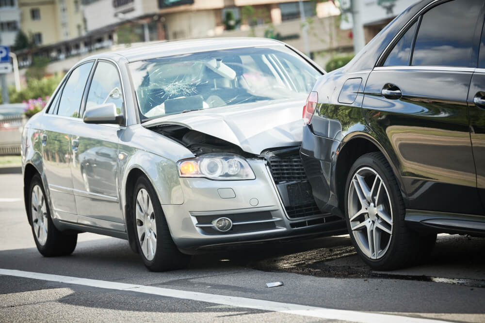 car crash accident on street with car insurance