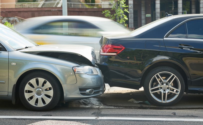 side view of a two cars in an accident