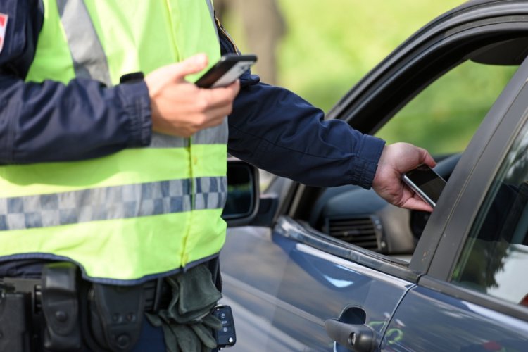 police officer pulling over driver