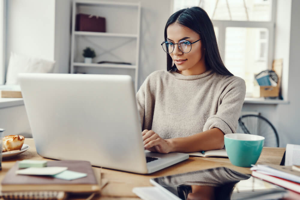 woman working from home in front of laptop