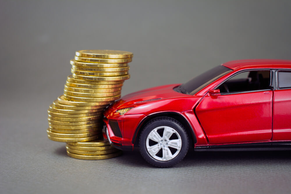 red car hit pile of coins