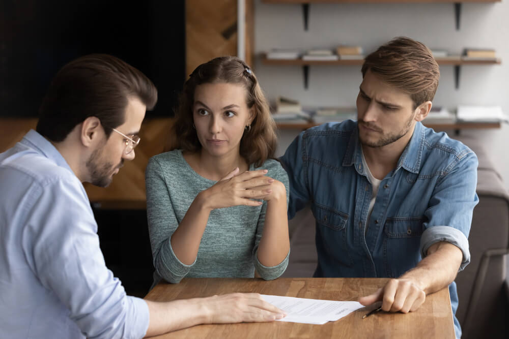 couple speaking to insurance agent