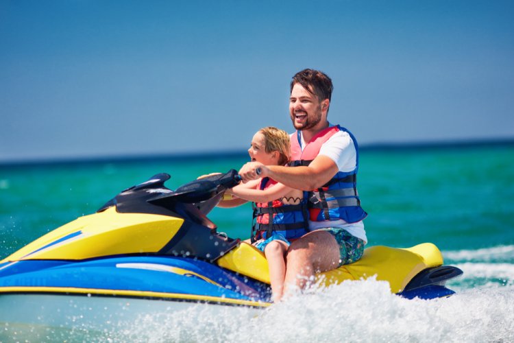Father and daughter on jet ski personal watercrfat