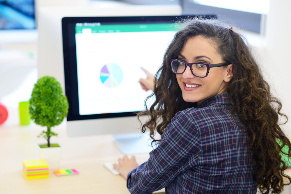 Latinx female checking her credit score on the computer