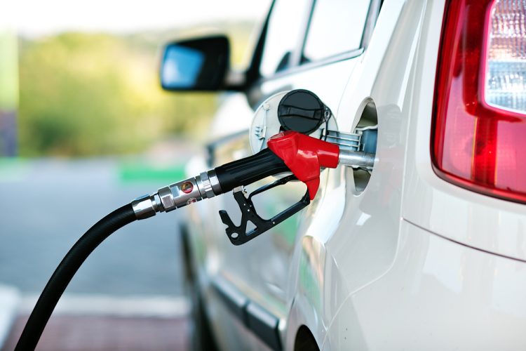 car with gas pump filling up tank