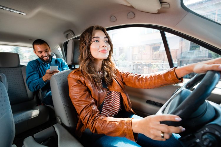 woman driving car as ride share service