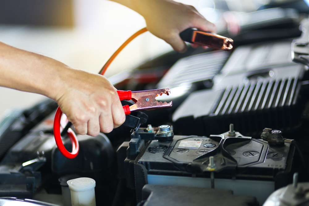 jumper cables near car engine