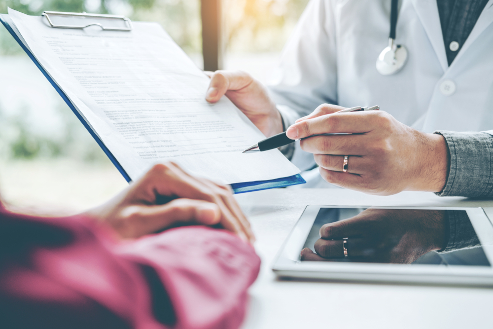 person going over insurance plan with patient