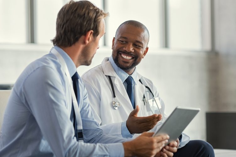 doctor speaking with patient smiling