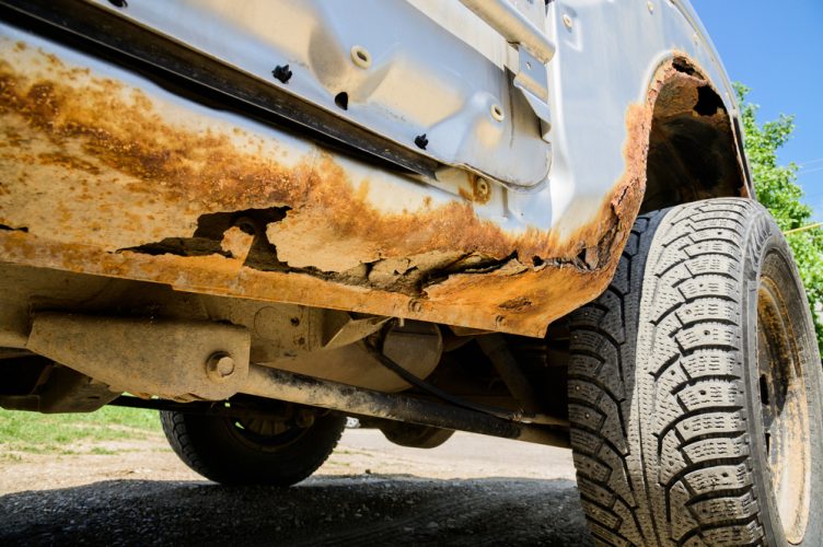 Bottom view of a car with rust damage