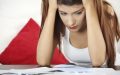 Young woman pulls her hair out of frustration confused by all the insurance options after getting a DUI
