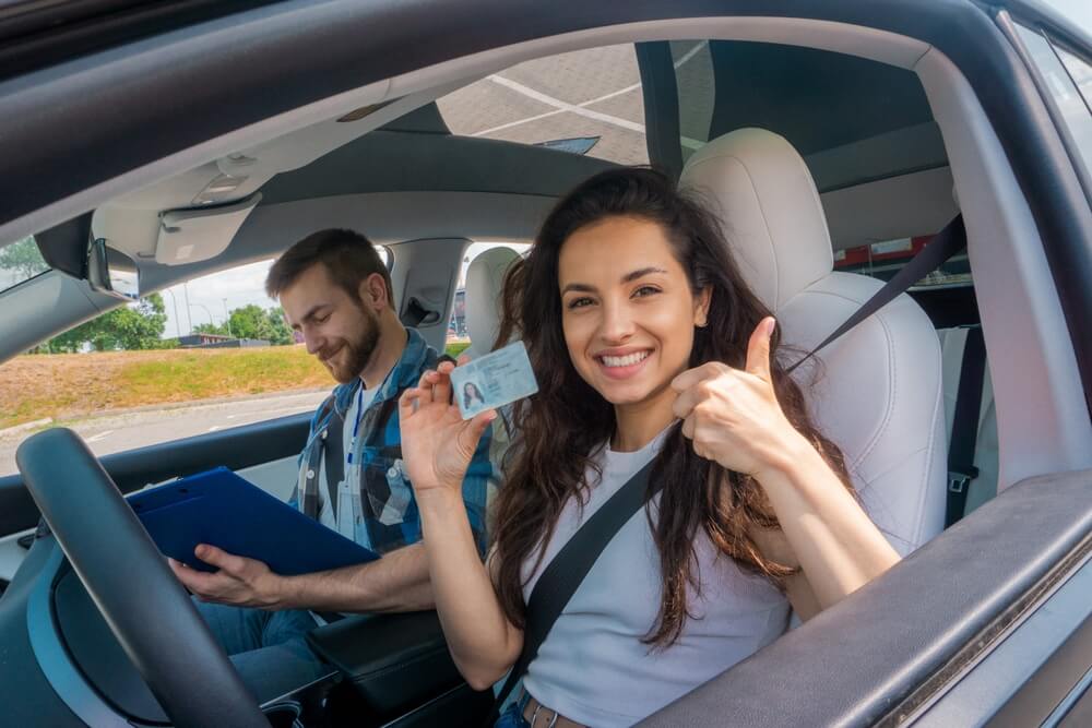Driver showing a newly reinstated driver's license after completing the requirements for an SR-22 following a suspended driver's license.