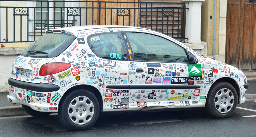 car with too many bumper stickers