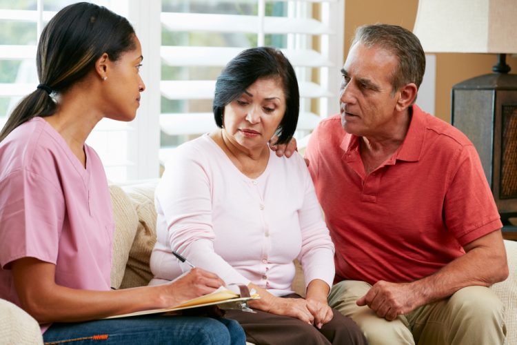 worried couple talks to nurse