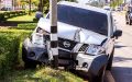 Car crashed into a city utility pole, causing damaged city property and visible front-end vehicle damage.