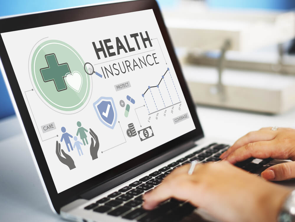 Health insurance information displayed on a laptop during Covered California open enrollment.