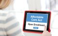 Woman looking at iPad ready to enter the Affordable Care Act Open Enrollment
