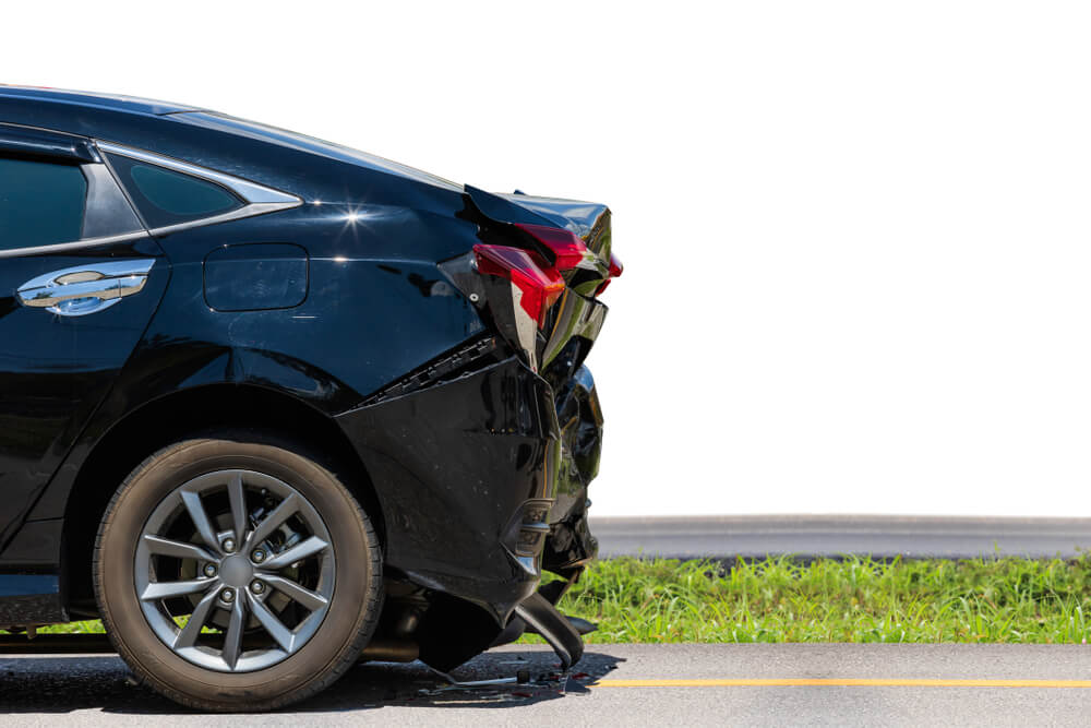 Back end of a black car that has been hit by an uninsured driver - cheap uninsured motorist coverage.