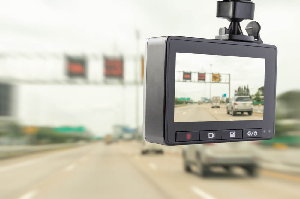 A dashcam records what happens around a vehicle on the road.