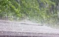 A roof is pounded by hail during a storm - cheap homeowners' insurance to protect against hail damage.