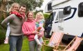 Family plays outside RV.