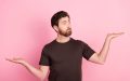 Portrait of man with stylish bristle wear brown shirt arms comparing liability and full coverage car insurance, which is best?