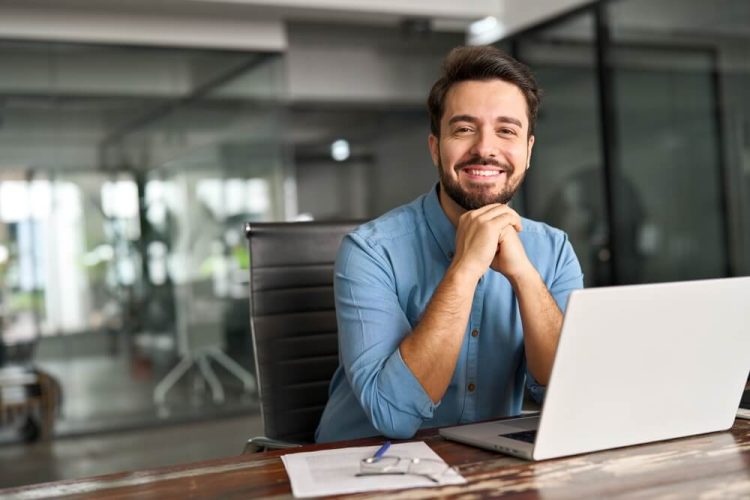 Happy professional business man saving money on business insurance.