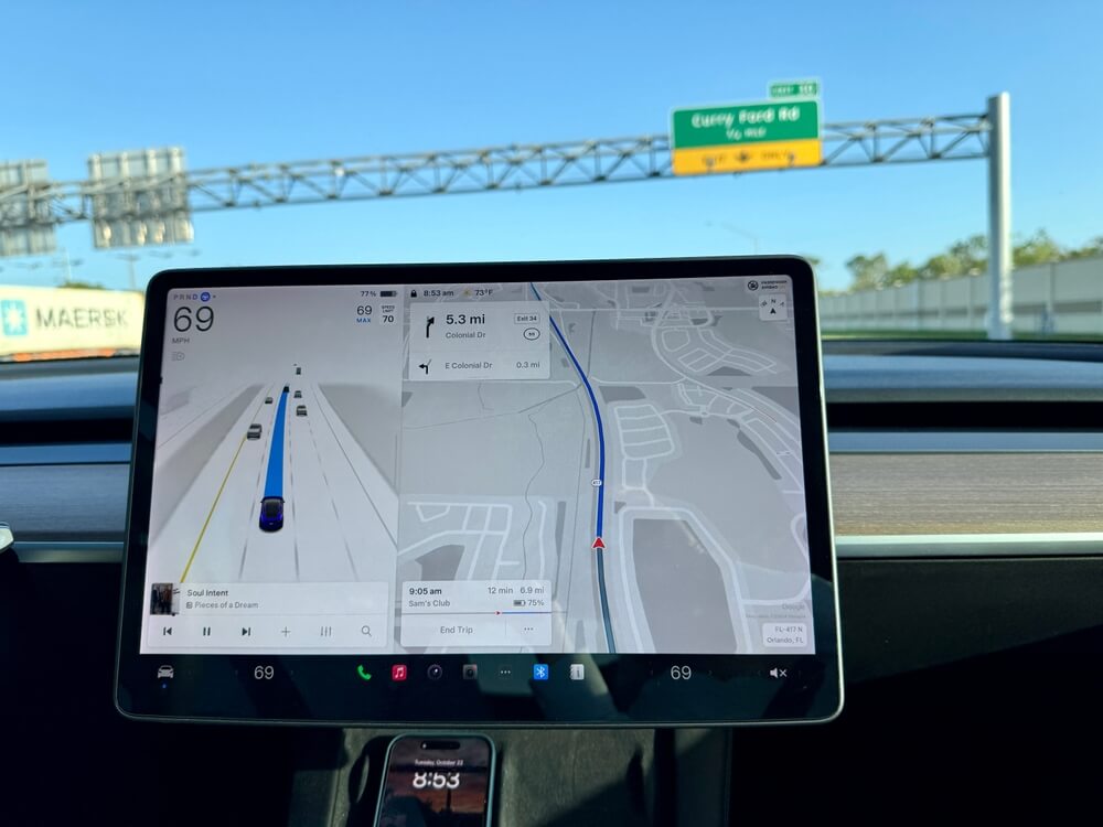 Car navigation screen during a trip, highlighting how car subscription services affect insurance coverage.