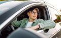 Driver behind the wheel of a car, illustrating how car subscription services affect insurance coverage.