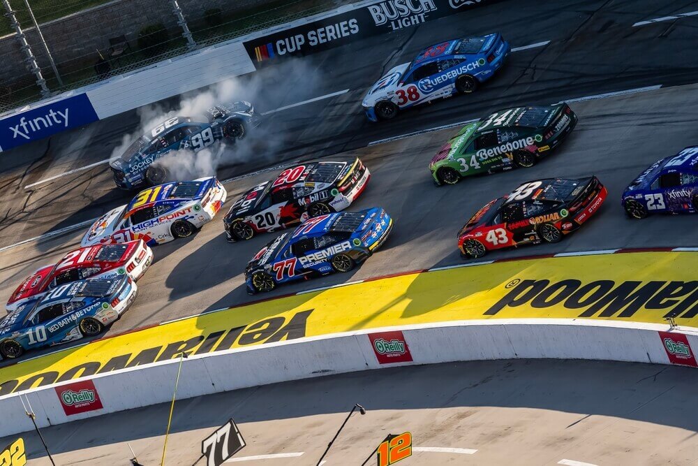 Phoenix Raceway strategic track racing as NASCAR drivers compete closely through a turn.