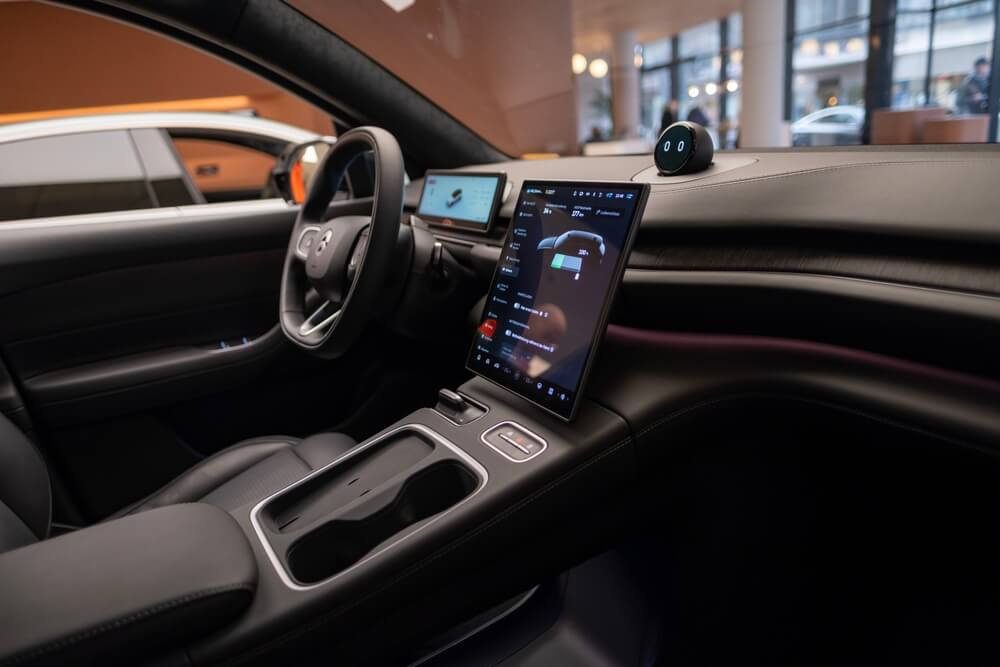 Modern vehicle interior with a digital dashboard highlighting advanced technology and vehicle software repairs.