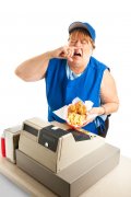 fast food worker sneezing on a meal.