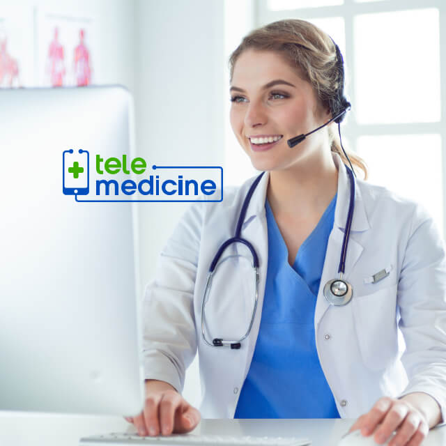 A doctor wearing a stethoscope uses a headset to communicate over a the internet.