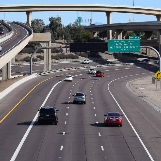 Picture of a highway crossroad in Phoenix, Arizona, showing bridges in different heights and a busy main road.