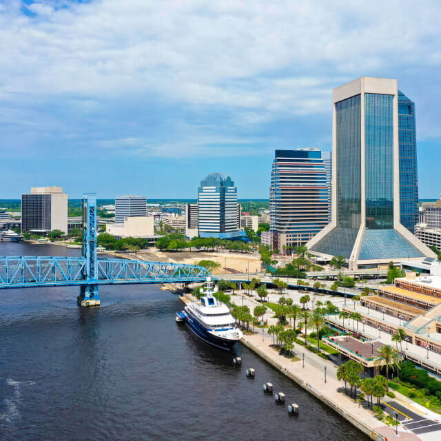 Aerial view of downtown Jacksonville skyline with bridge and river