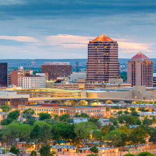 Panoramical view of Albuquerque city in the afternoon with many buildings and trees