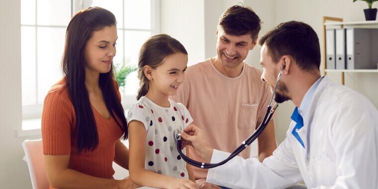 A girl and her mother and father happy with health insurance visiting a doctor