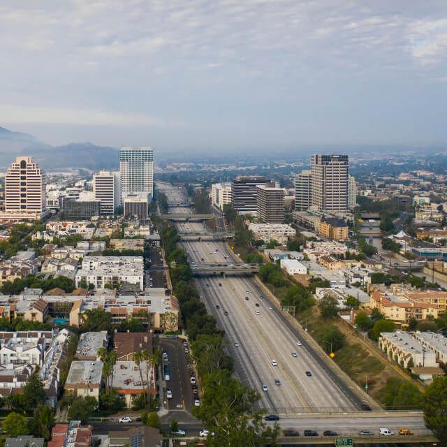 Downtown Glendale at dusk with glendale mountains in the background