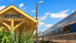 Train station with parked train and sign that says kissimmee