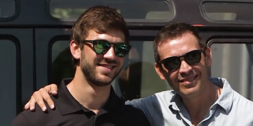Candid shot of NASCAR Cup Series Driver and Xfinity Series Champion Daniel Suarez with another man