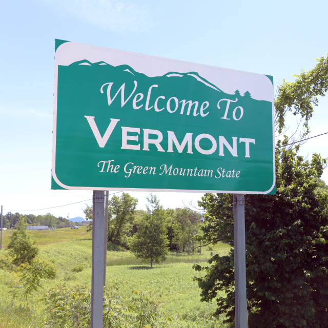 A welcome sign on the Vermont state line.