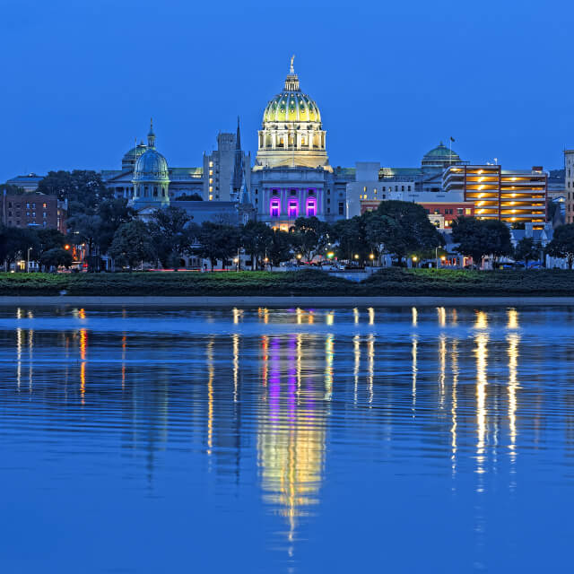 The Harrisburg Pennsylvania skyline with the state capital building and the Susquehanna River.