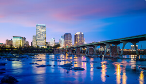 Downtown Richmond, Virginia skyline and the James River at twilight.