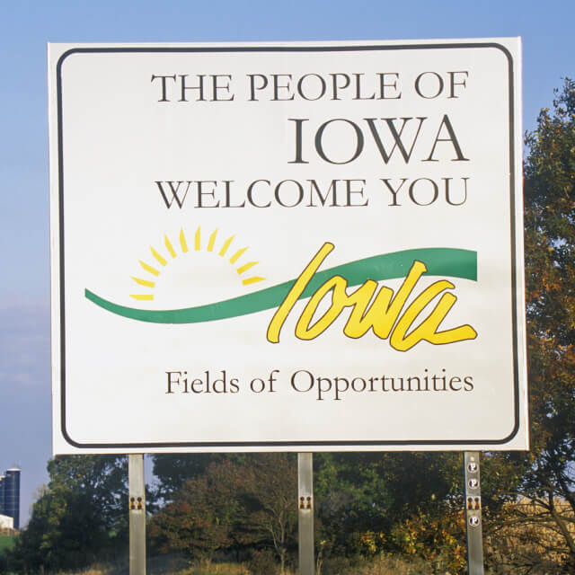 Welcome to the Iowa sign seen against the clouds. Iowa, USA