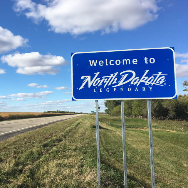 Welcome to North Dakota sign at state line