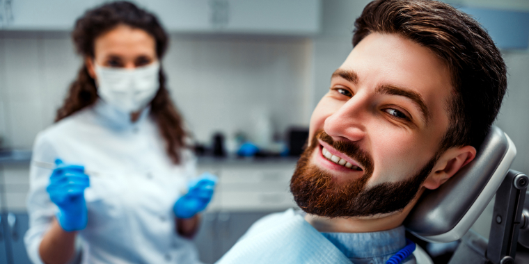 Happy man in the dental chair.