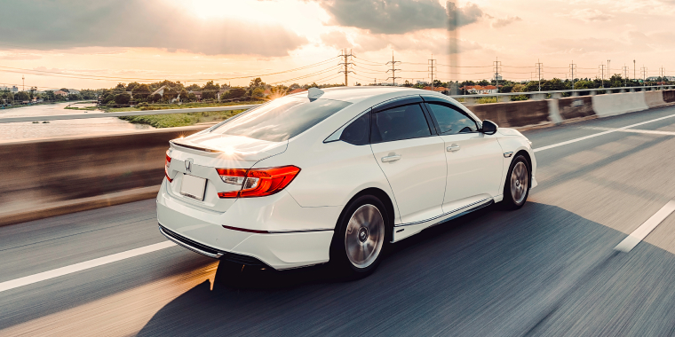 White Honda Accord car in the highway