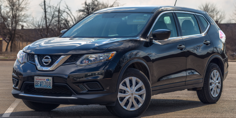 Photo of black Nissan Rogue in the open air